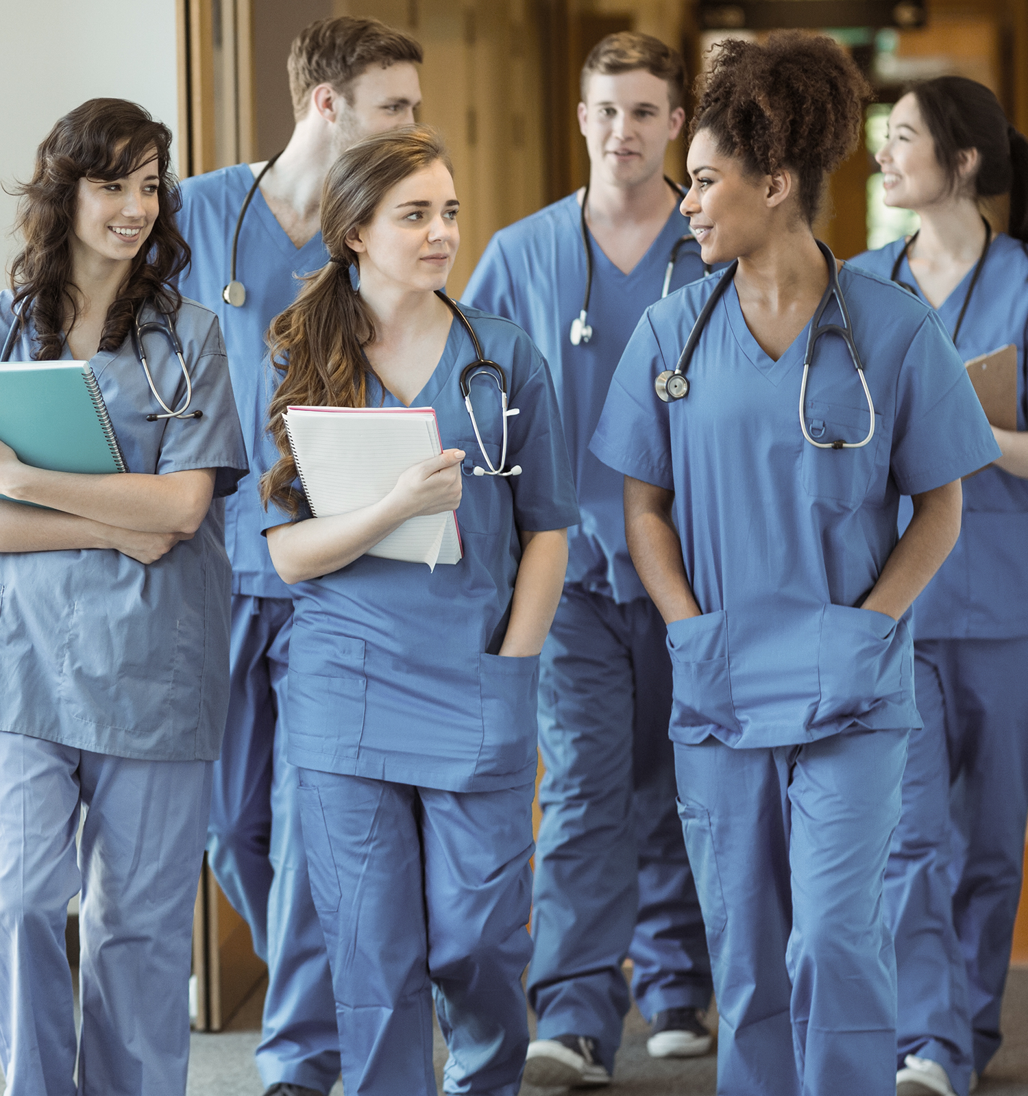 Medical students walking through hallway