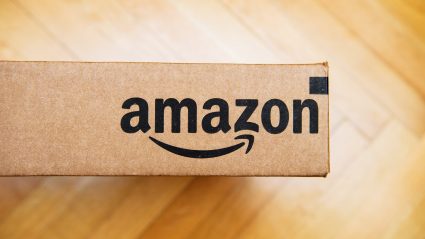 amazon logo on box on wood floor
