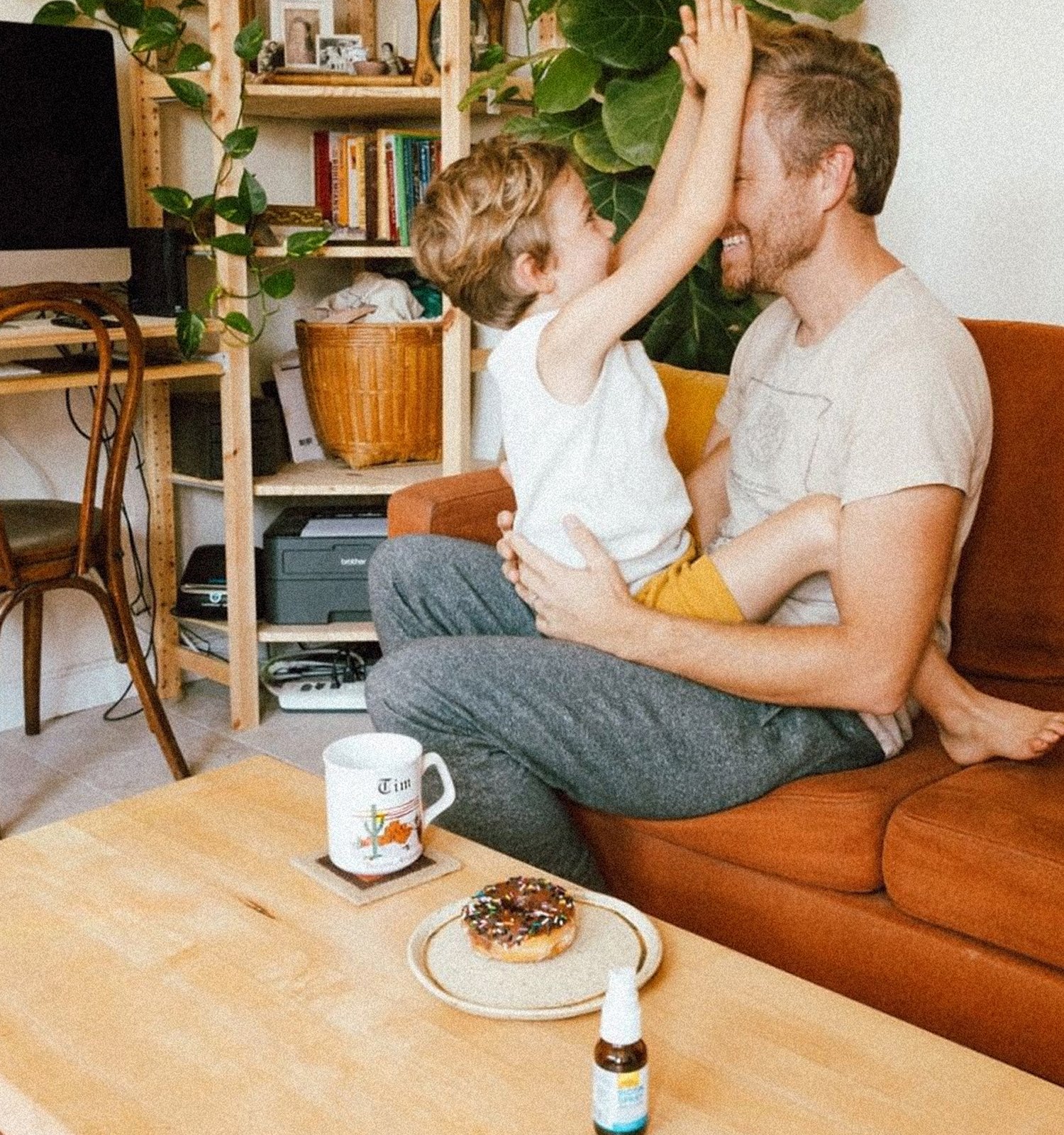 father and son in living room
