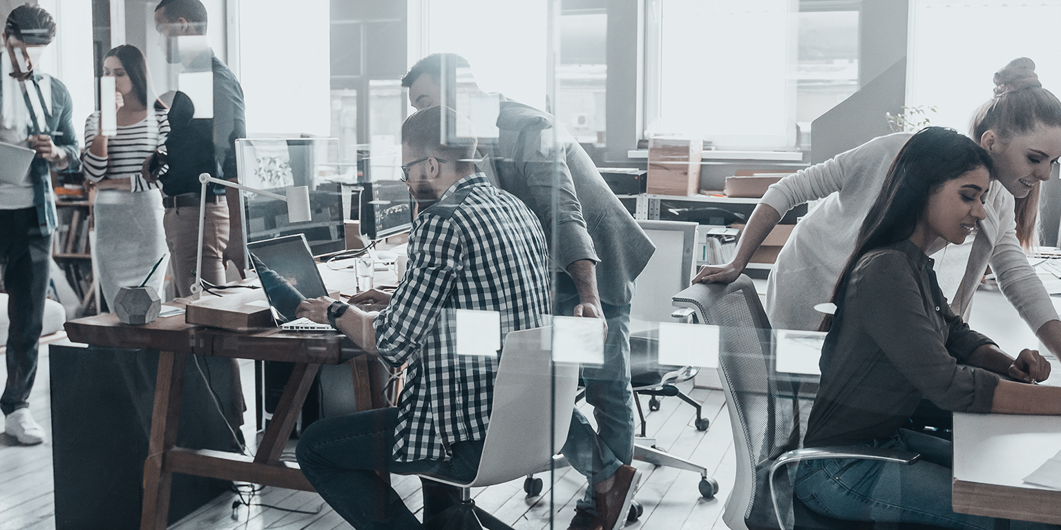 Group working in open office space